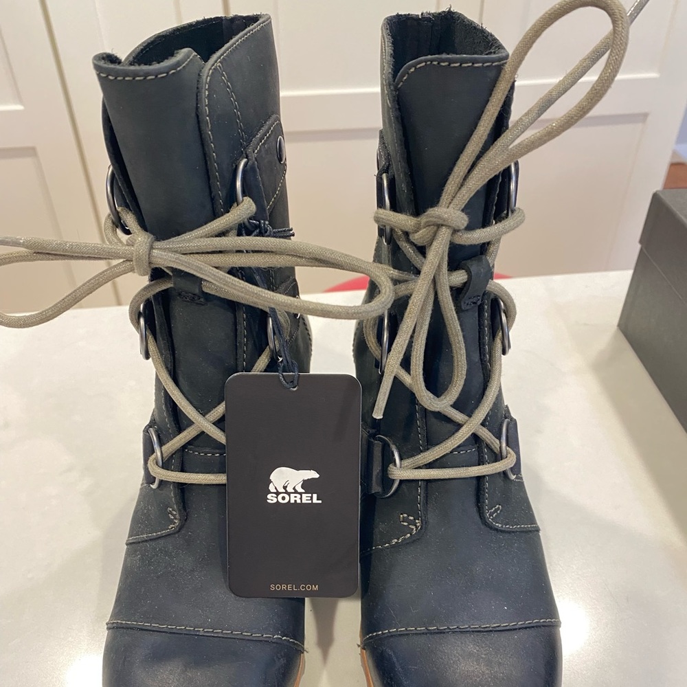 Unused waterproof Sorel boots with stacked heel - size 6. Never worn.